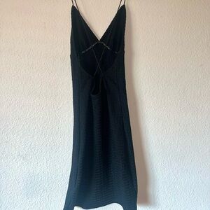 XS H&M black mini dress with cross straps on a low back